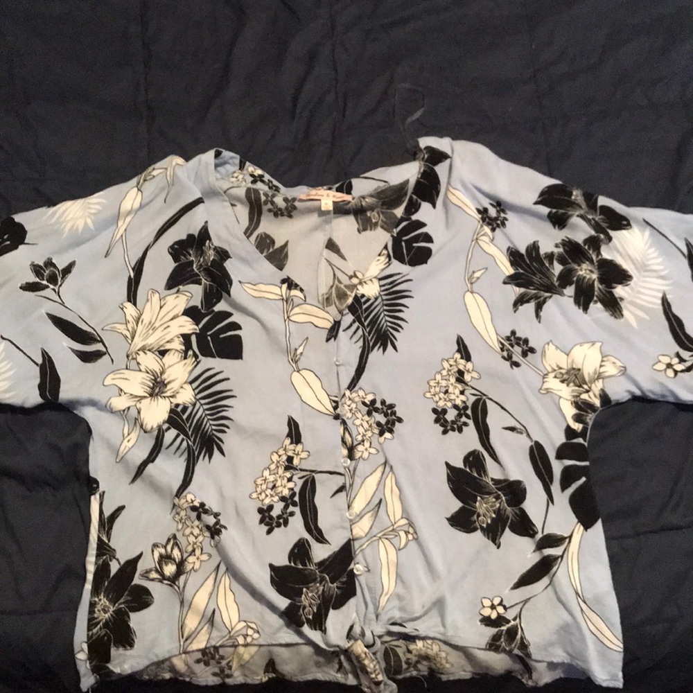 Blue, black, and white floral button up shirt